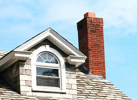 close up to dormer and brick chimney