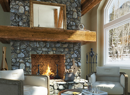 Large round stone fireplace lighten up during winter day