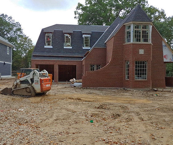 Building red brick house in progress
