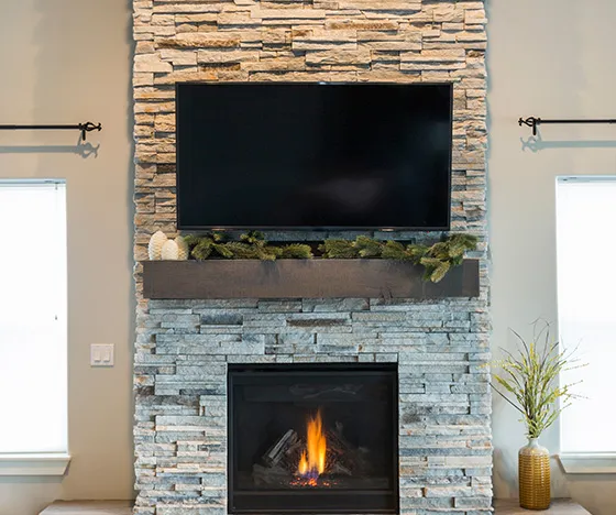 close up to stone fireplace in the living room after fireplace installation service