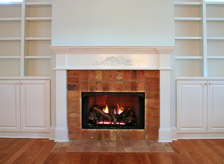 Small traditional brick fireplace after the installation