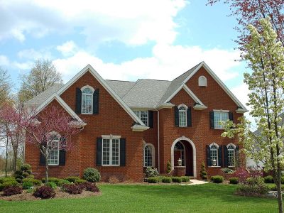 A red brick colonial style house.